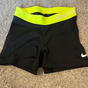 Black and neon yellow Nike Pro shorts. Workout/athletic shorts.